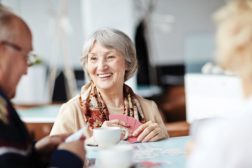 The Cottages of Fox Lake - Assisted Living and Memory Care Senior Living - residents playing cards