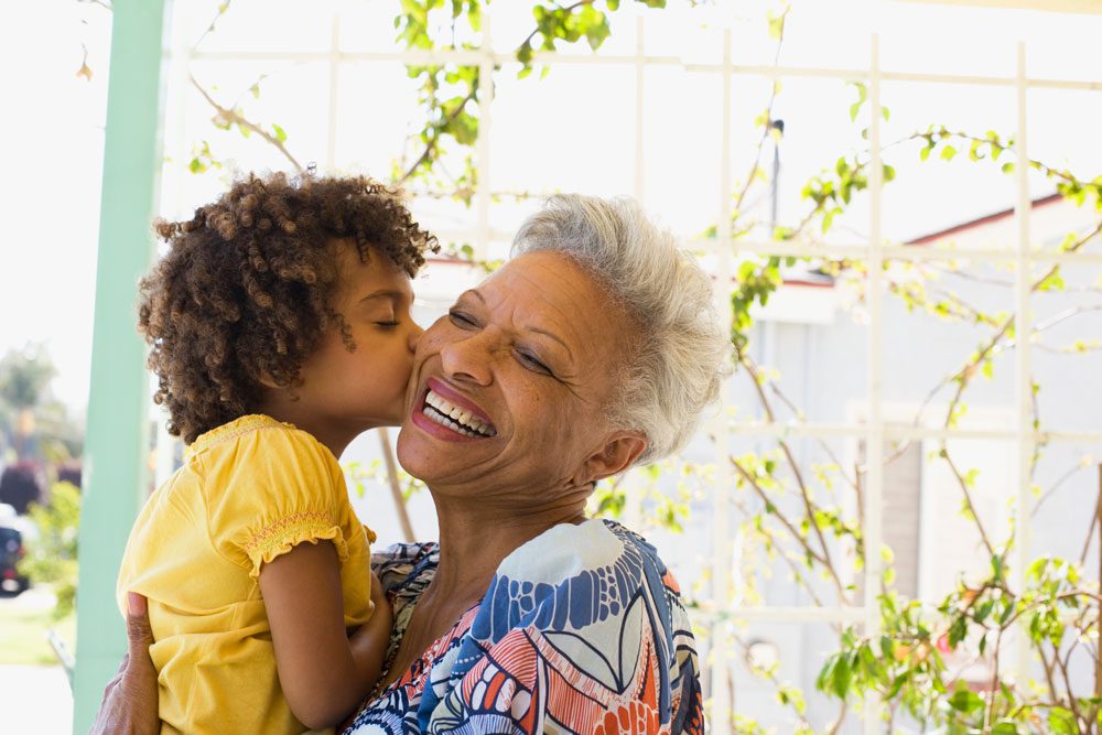 The Cottages of Fox Lake - Assisted Living and Memory Care Senior Living - resident with grandchild